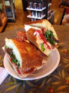 proscuitto, provolone, mesculin field greens, roated tomaotes, and house dressing on foccaicia