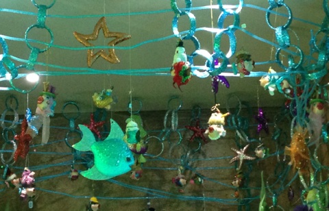 even art hanging from the ceiling as you enter the restroom is intriguing