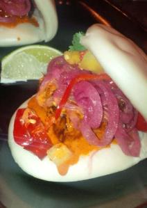 pork on steamed bun with pickled vegetables