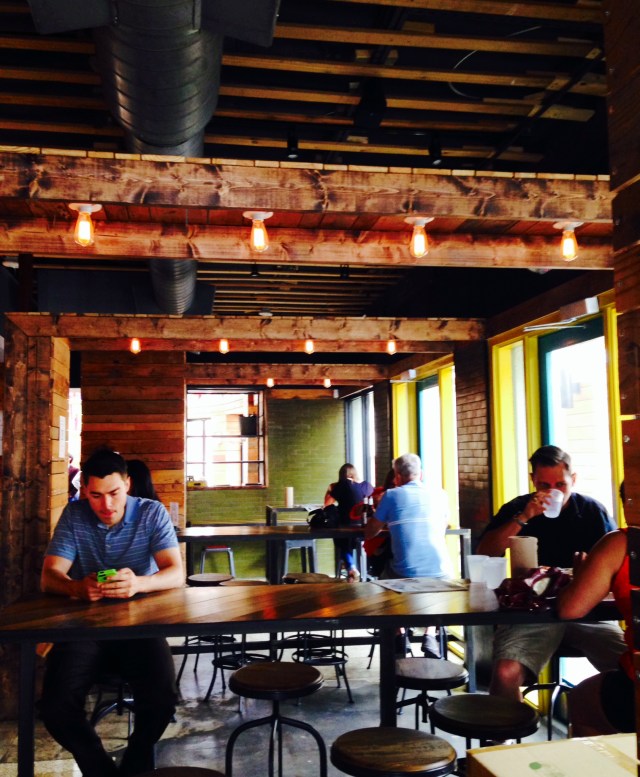 in this dining room you can watch the chefs in the open air kitchen pulverize dried chilis with mortar and pestle