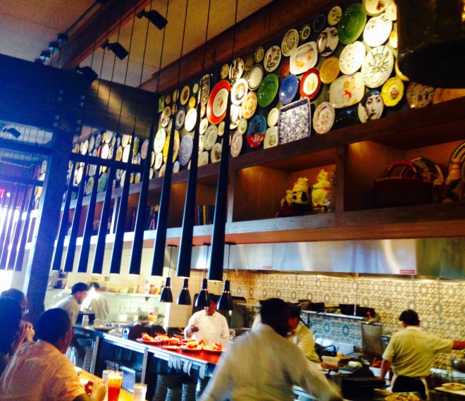 ...an open kitchen but your eye is drawn to the massive collection of plates above!